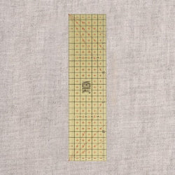 règle de repassage graduée thermorésistante de 25X6,5cm (prix à la pièce)