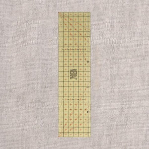 règle de repassage graduée thermorésistante de 25X6,5cm (prix à la pièce)